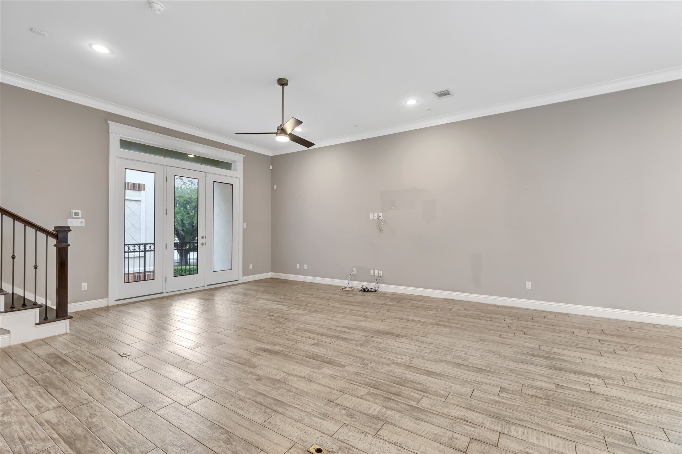 2810 Princeton Street Houston, TX 77009 - Photo 8 of 31 a view of an empty room with wooden floor and a window