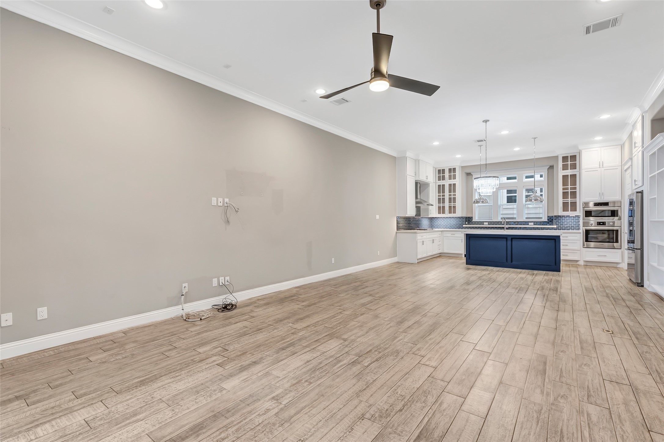 2810 Princeton Street Houston, TX 77009 - Photo 9 of 31 a view of kitchen and hall with wooden floor
