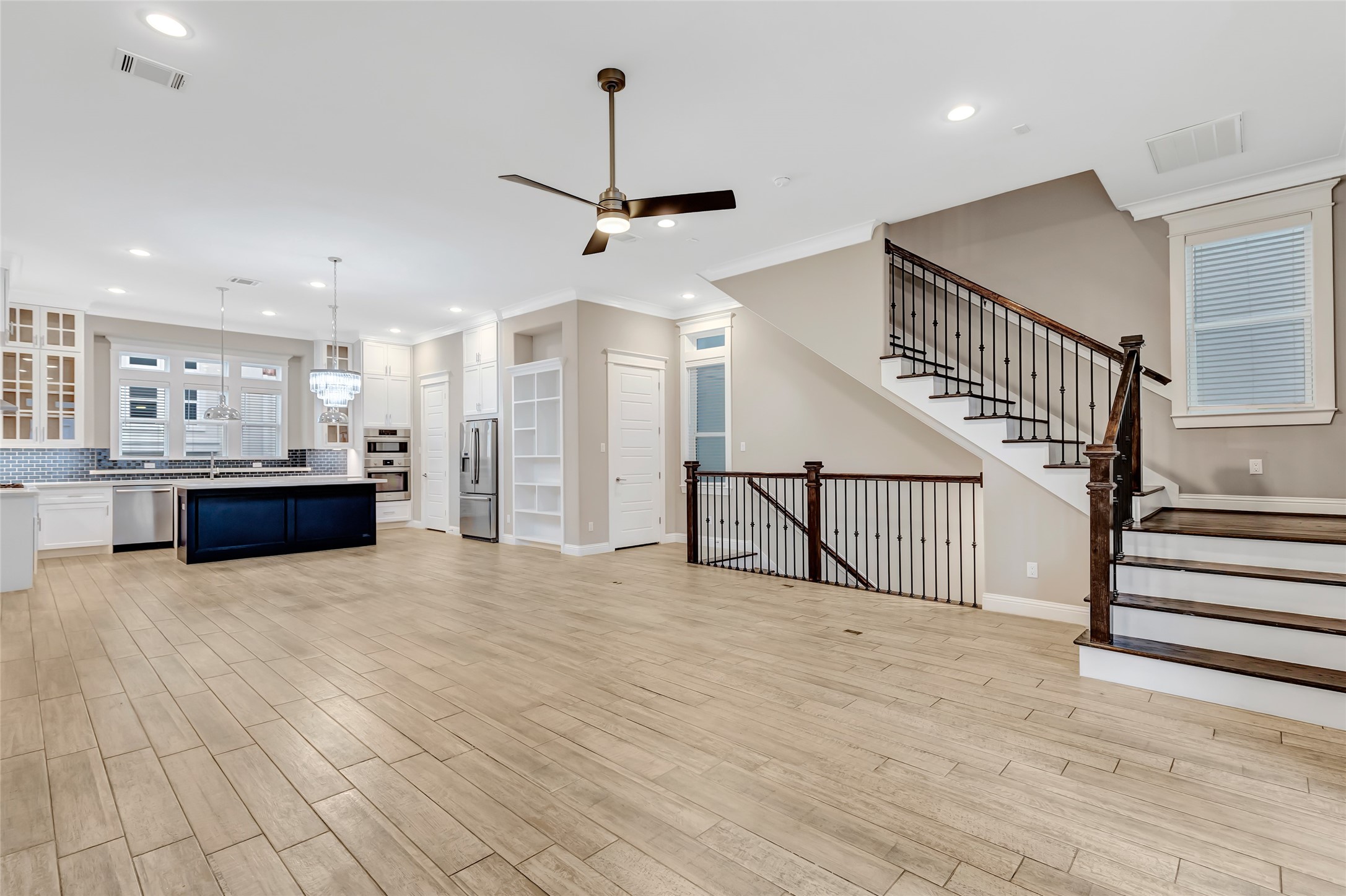 2810 Princeton Street Houston, TX 77009 - Photo 10 of 31 a view of kitchen and hall with wooden floor