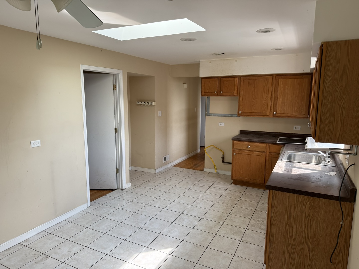 8114 South Anthony Avenue Chicago, IL 60617 - Photo 11 of 25 a kitchen that has a sink and a stove in it