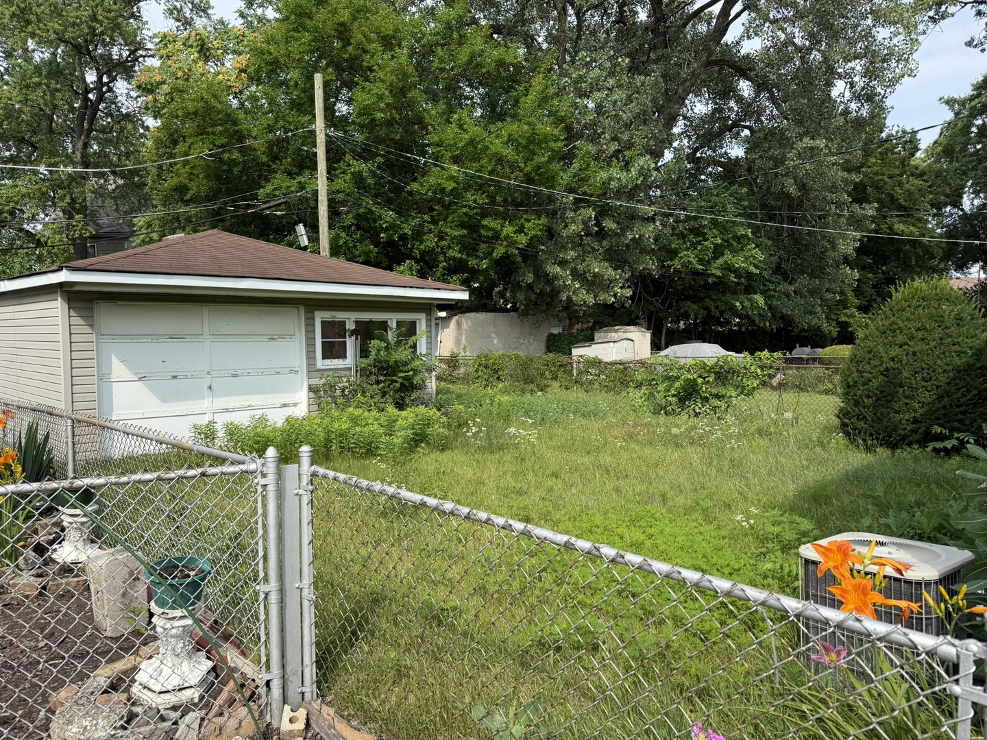 8114 South Anthony Avenue Chicago, IL 60617 - Photo 24 of 25 a front view of house with yard and green space