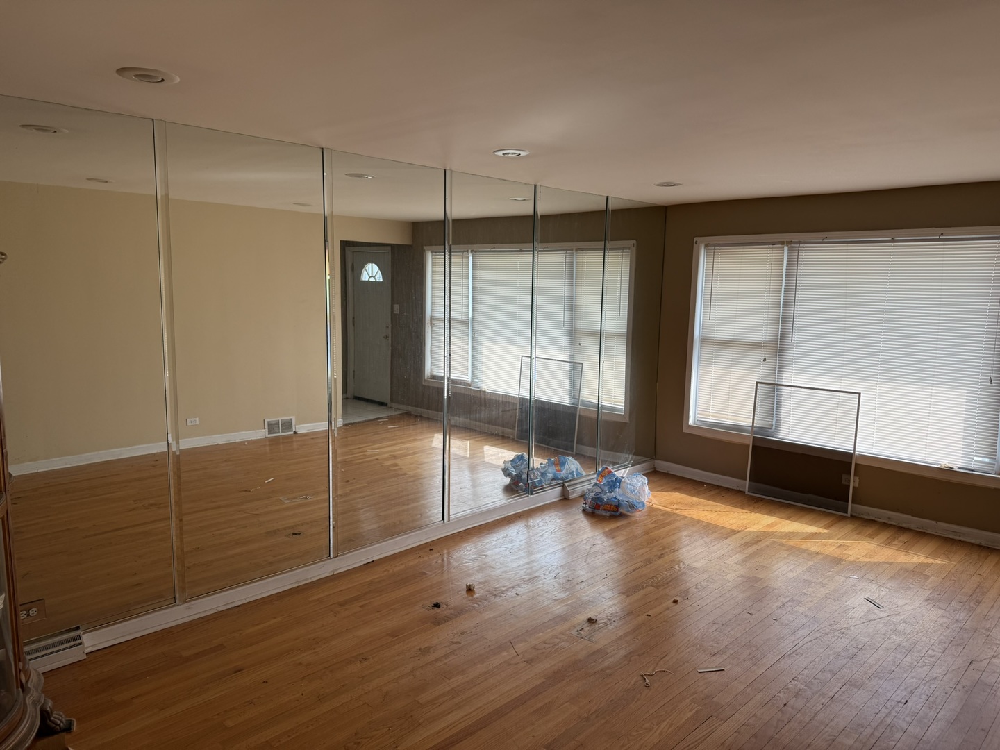 8114 South Anthony Avenue Chicago, IL 60617 - Photo 3 of 25 a view of a room with gym equipment and a large window