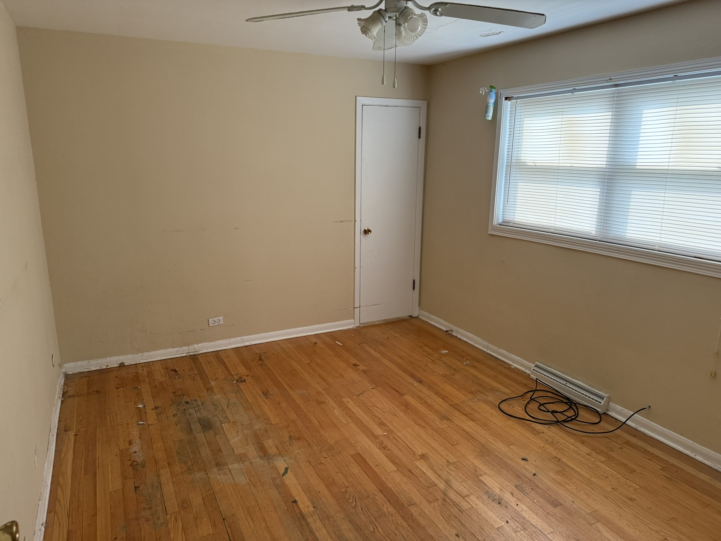 8114 South Anthony Avenue Chicago, IL 60617 - Photo 4 of 25 a view of an empty room with a window