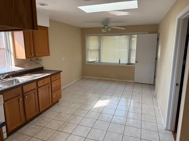 a kitchen that has a sink and a stove in it