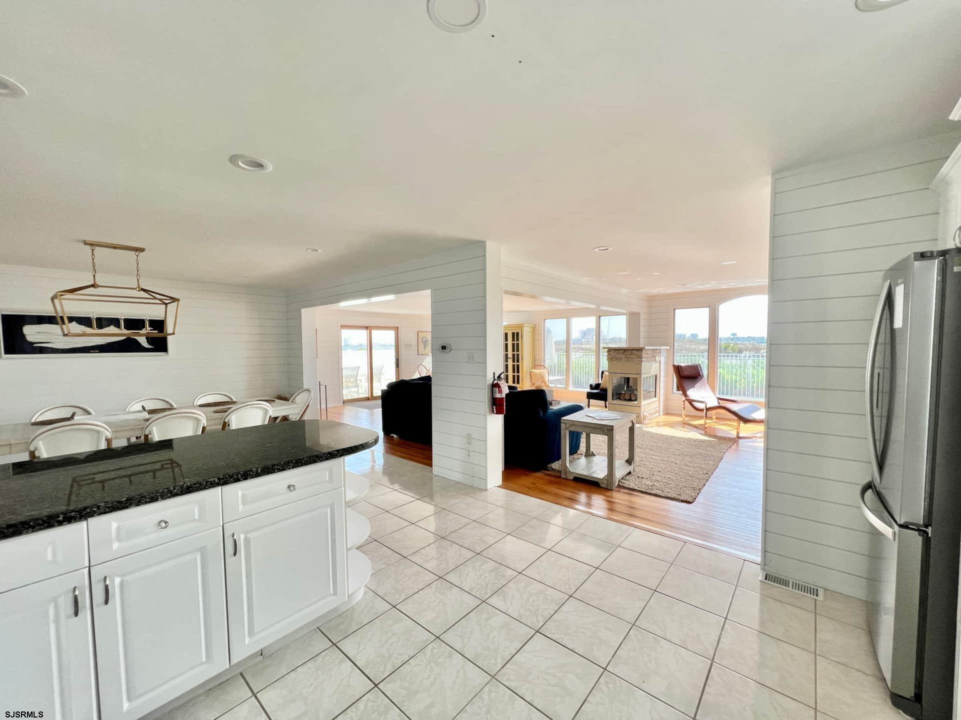 24 Ocean Drive West Brigantine, NJ 08203 - Photo 11 of 48 a living room with furniture and a flat screen tv