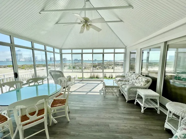 a very nice looking living room with a large window and furniture
