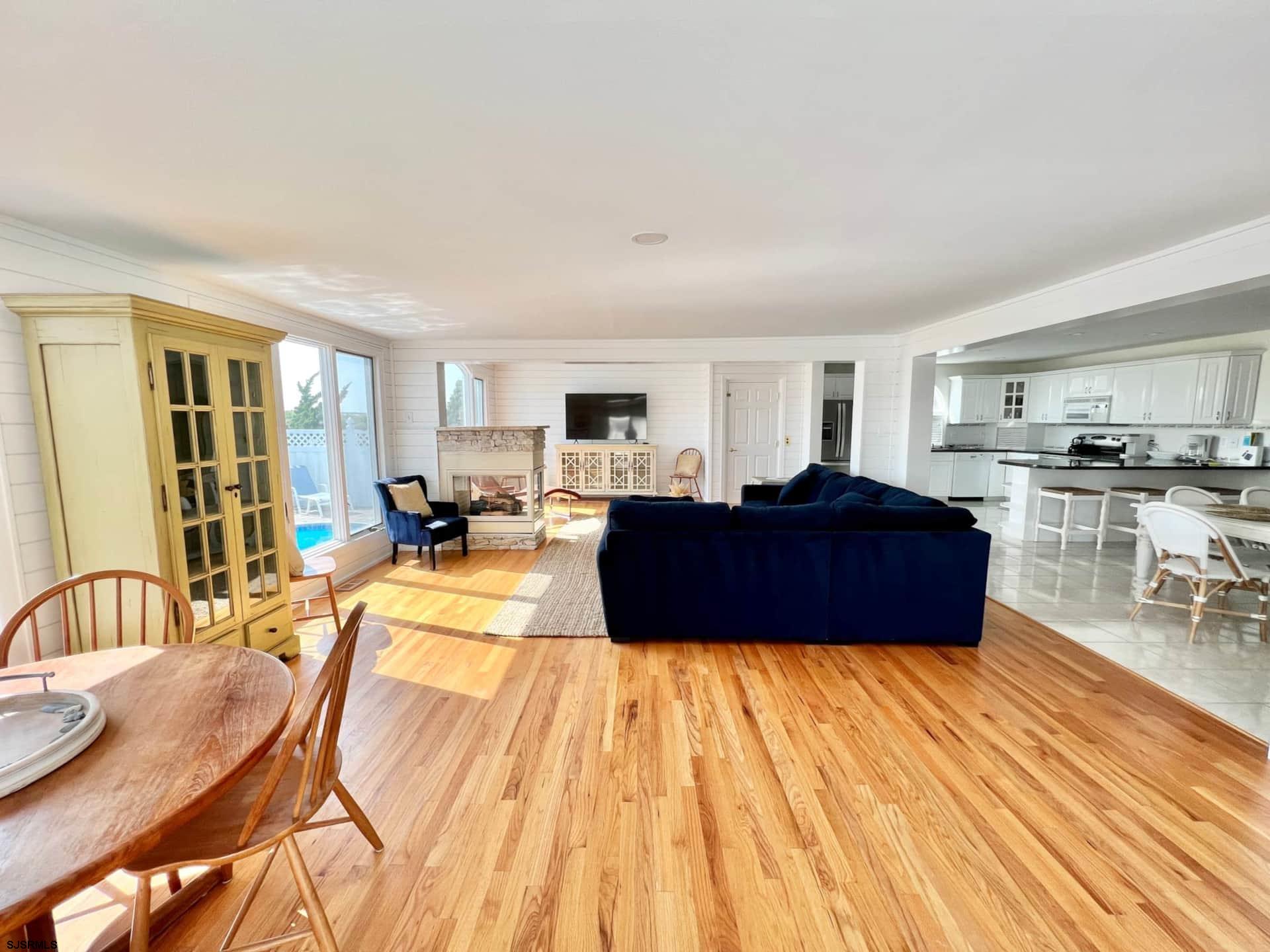 24 Ocean Drive West Brigantine, NJ 08203 - Photo 16 of 48 a living room with furniture a wooden floor and kitchen view