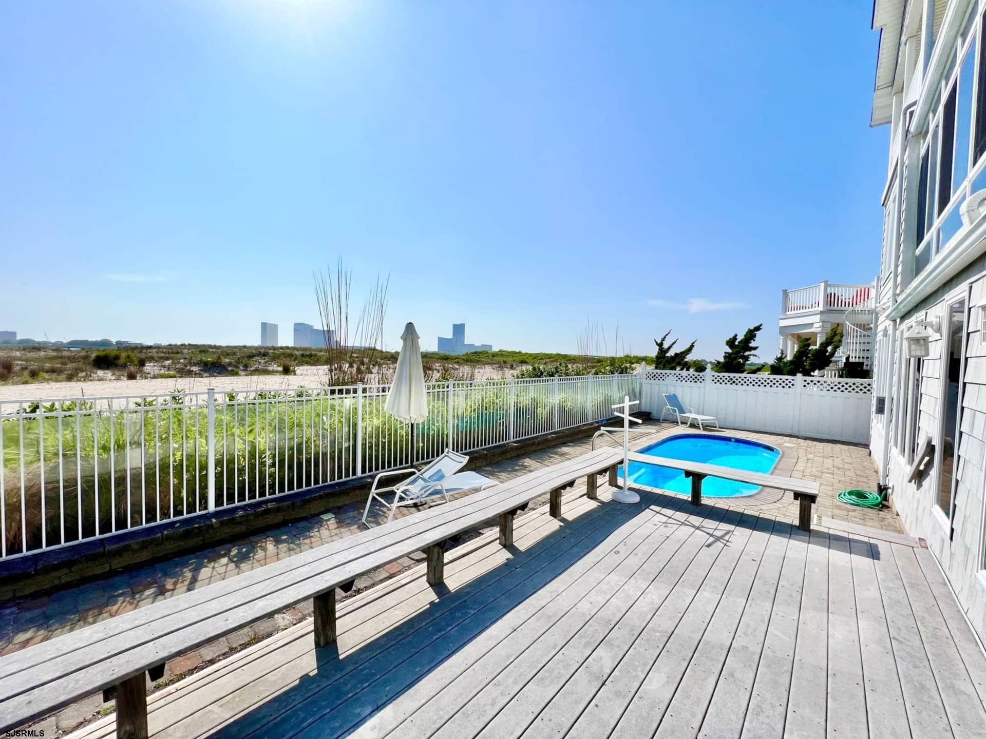 24 Ocean Drive West Brigantine, NJ 08203 - Photo 21 of 48 a view of a terrace with wooden floor and lake view