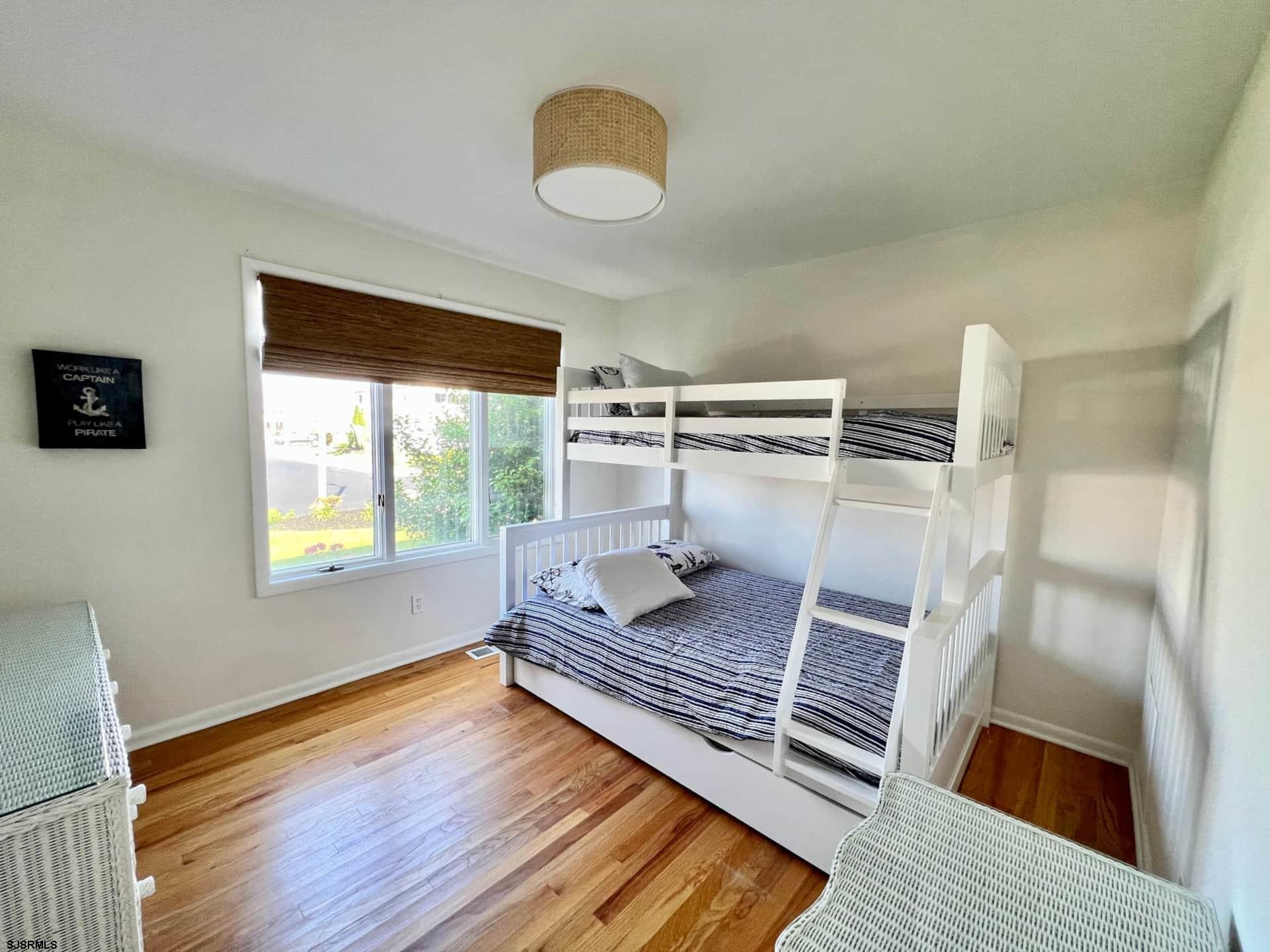24 Ocean Drive West Brigantine, NJ 08203 - Photo 30 of 48 a living room with a rug floor and a large window