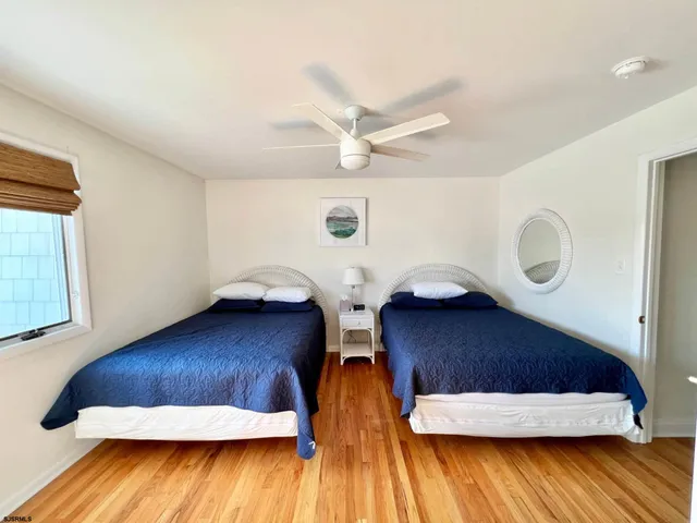a view of wooden floor and windows in a room