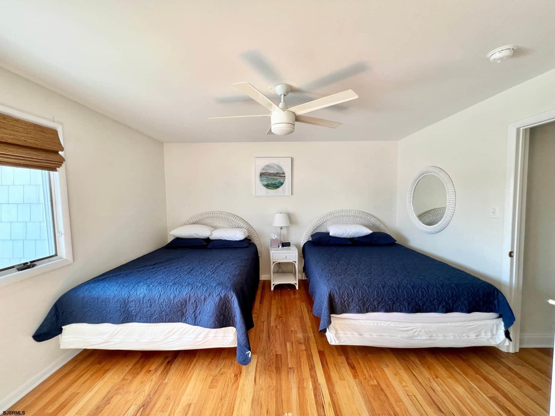 24 Ocean Drive West Brigantine, NJ 08203 - Photo 34 of 48 a view of wooden floor and windows in a room