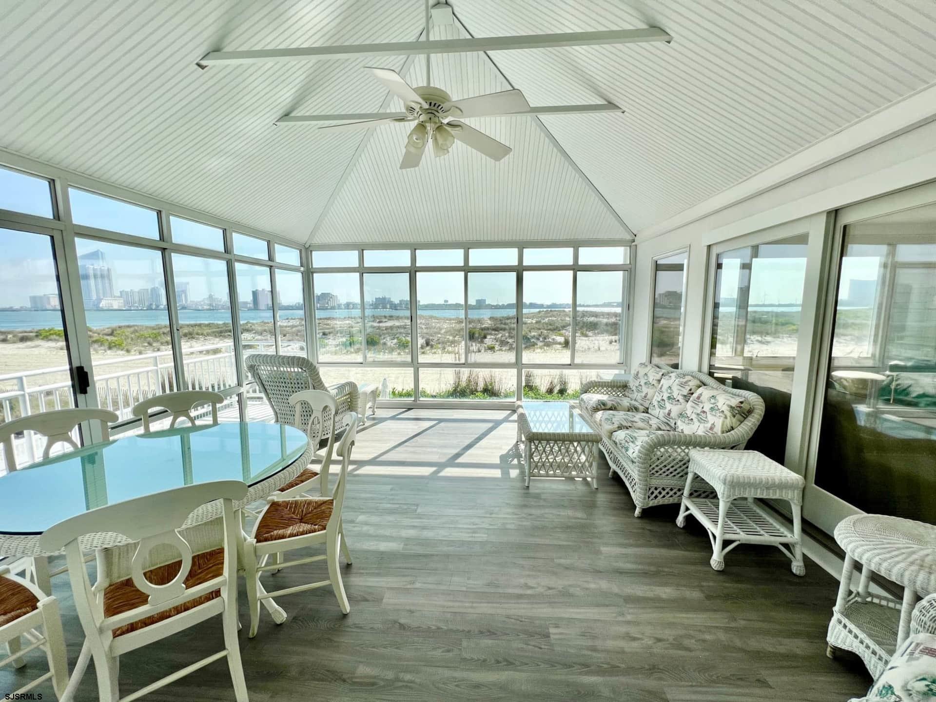 24 Ocean Drive West Brigantine, NJ 08203 - Photo 40 of 48 a very nice looking living room with a large window and furniture