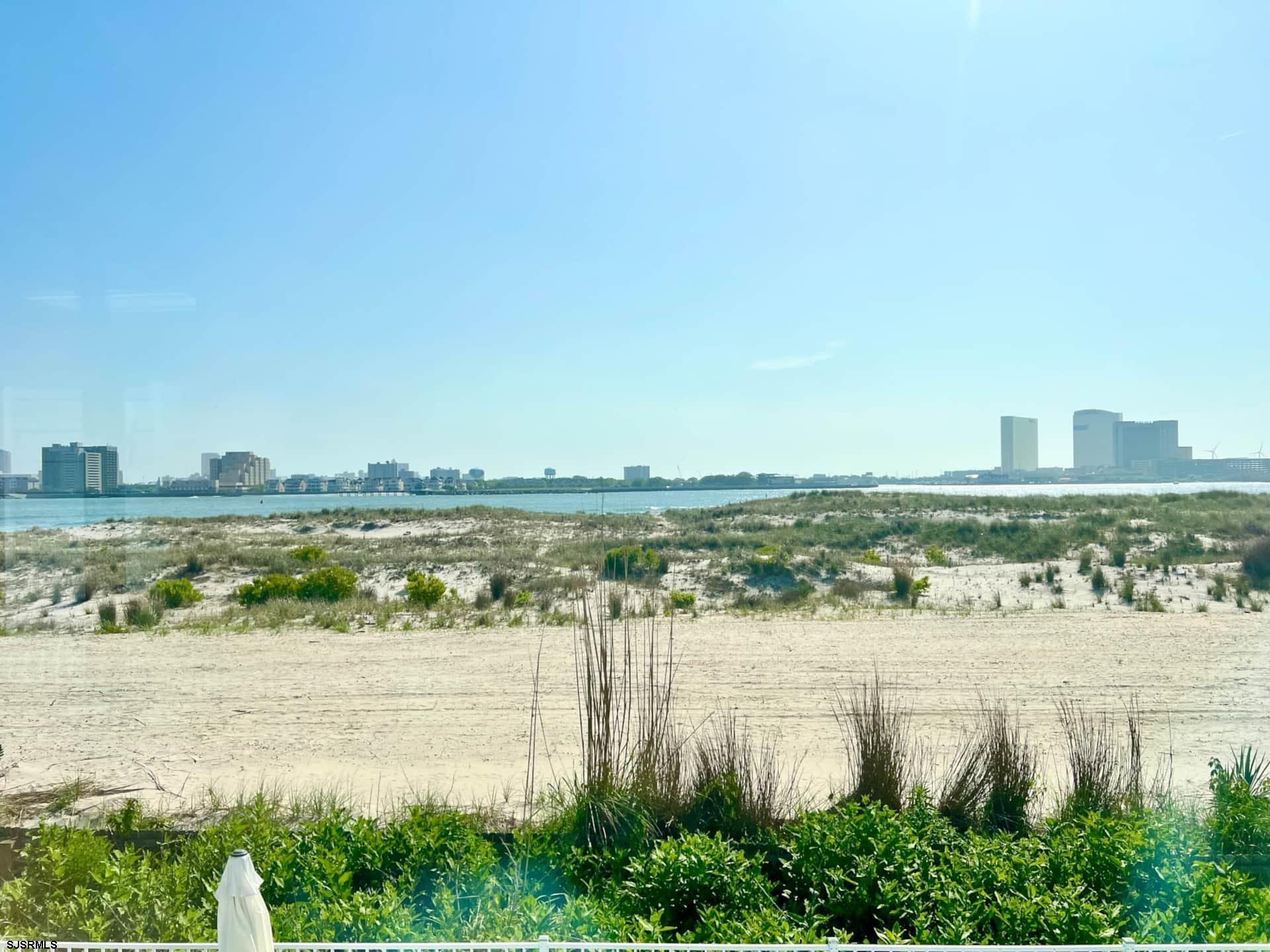 24 Ocean Drive West Brigantine, NJ 08203 - Photo 48 of 48 a view of a lake with a city