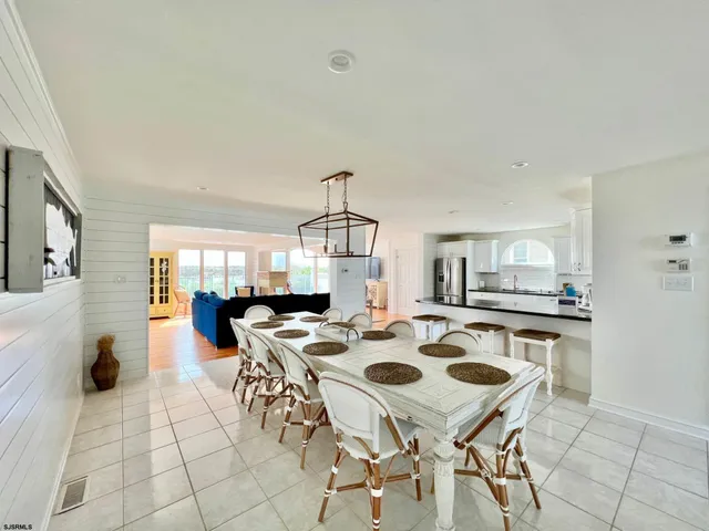 a view of a dining table and chairs in the kitchen