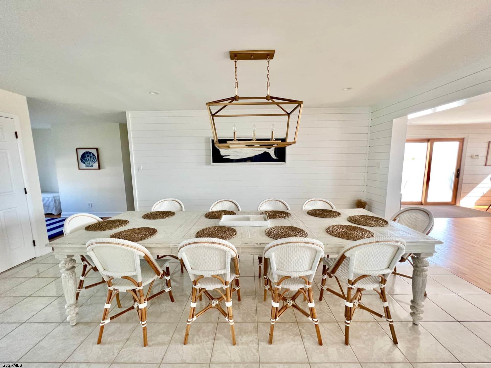 24 Ocean Drive West Brigantine, NJ 08203 - Photo 7 of 48 a view of a dining room a livingroom and furniture