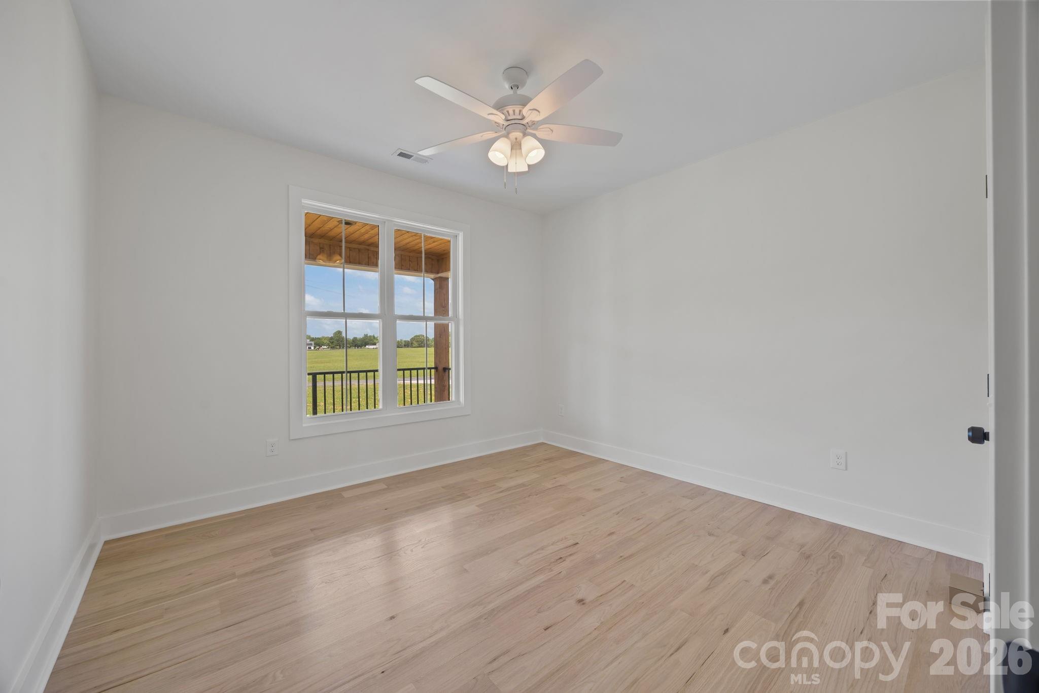 4805 Patterson Road China Grove, NC 28023 - Photo 31 of 42 a view of an empty room with wooden floor and a window