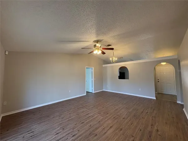 a kitchen with a refrigerator stove and microwave