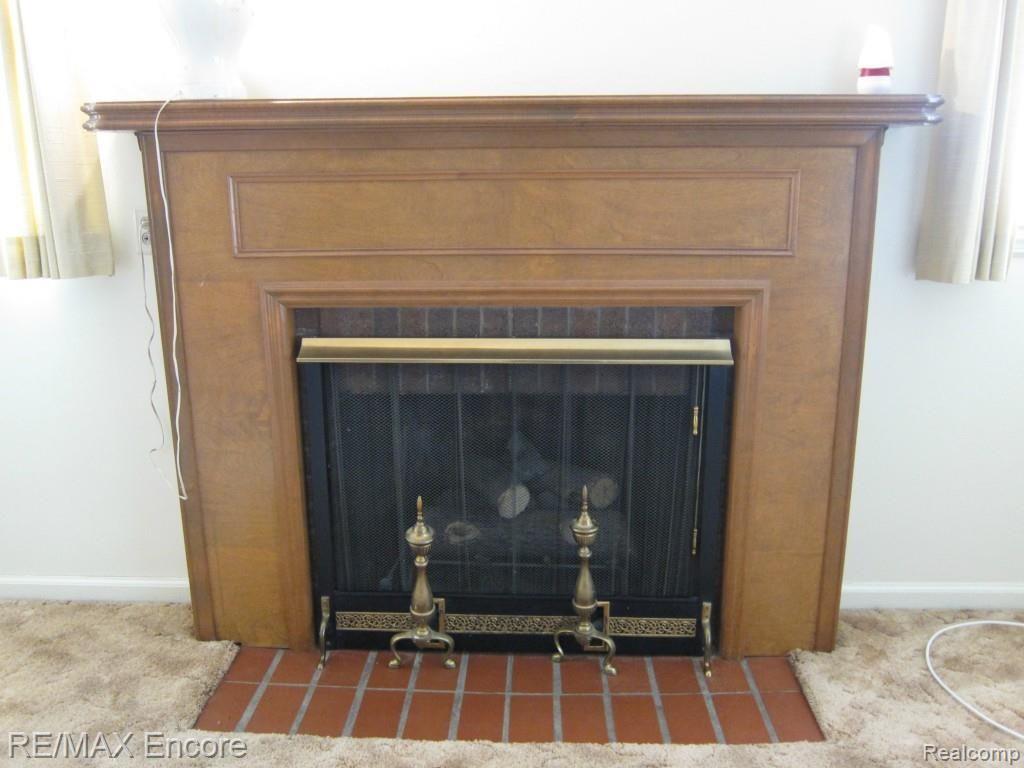 1424 North Genesee Road Burton, MI 48509 - Photo 8 of 26 Fireplace with Wood Mantle