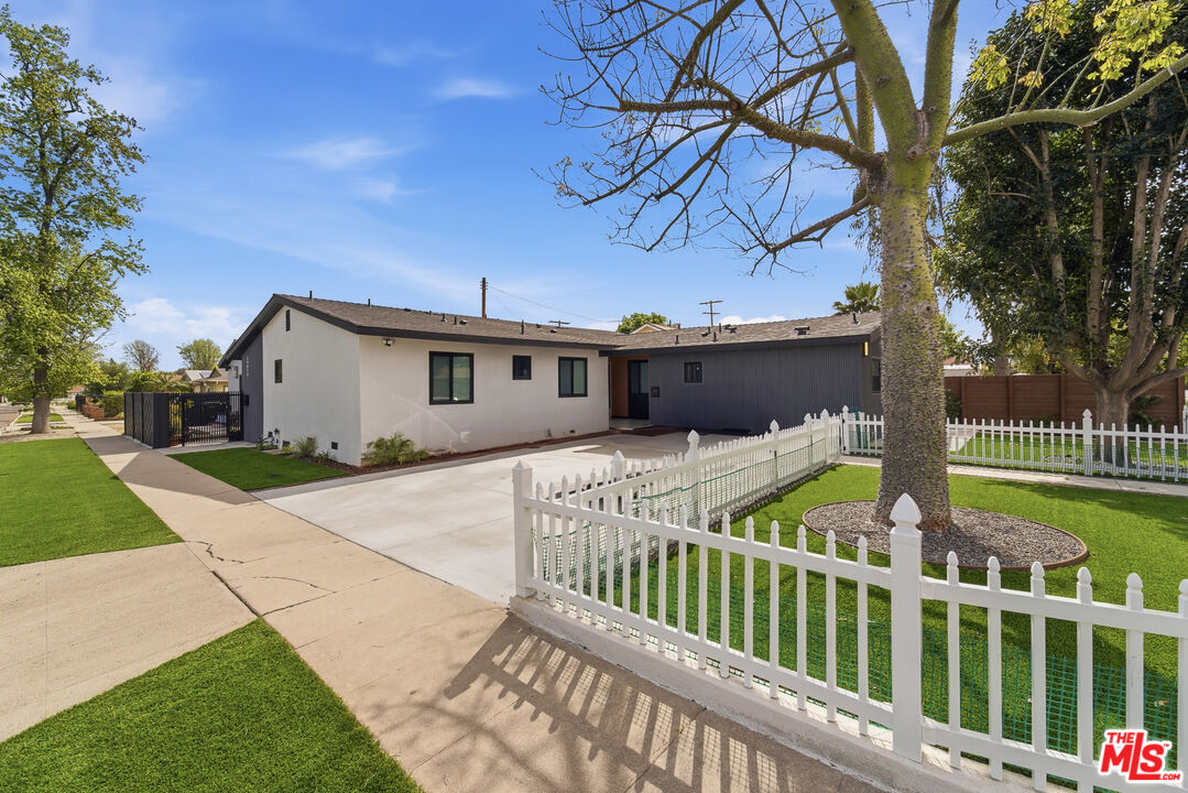6724 Hesperia Avenue Reseda, CA 91335 - Photo 3 of 5 a front view of a house with garden