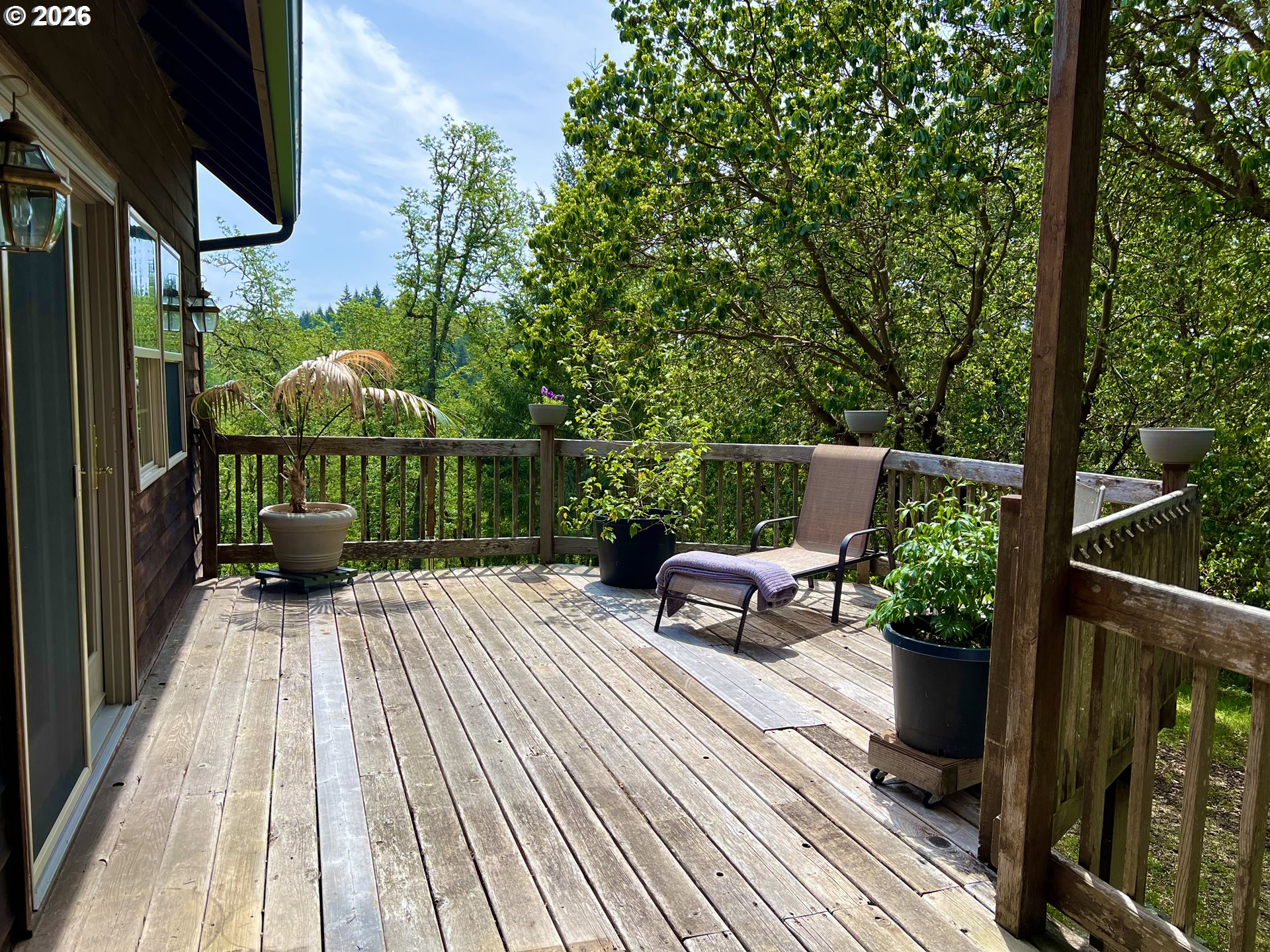 28544 Crow Road Eugene, OR 97402 - Photo 17 of 48 a view of a chairs and table on the wooden deck