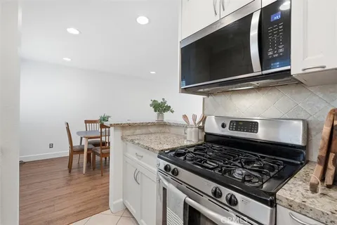 a kitchen with a stove and a microwave