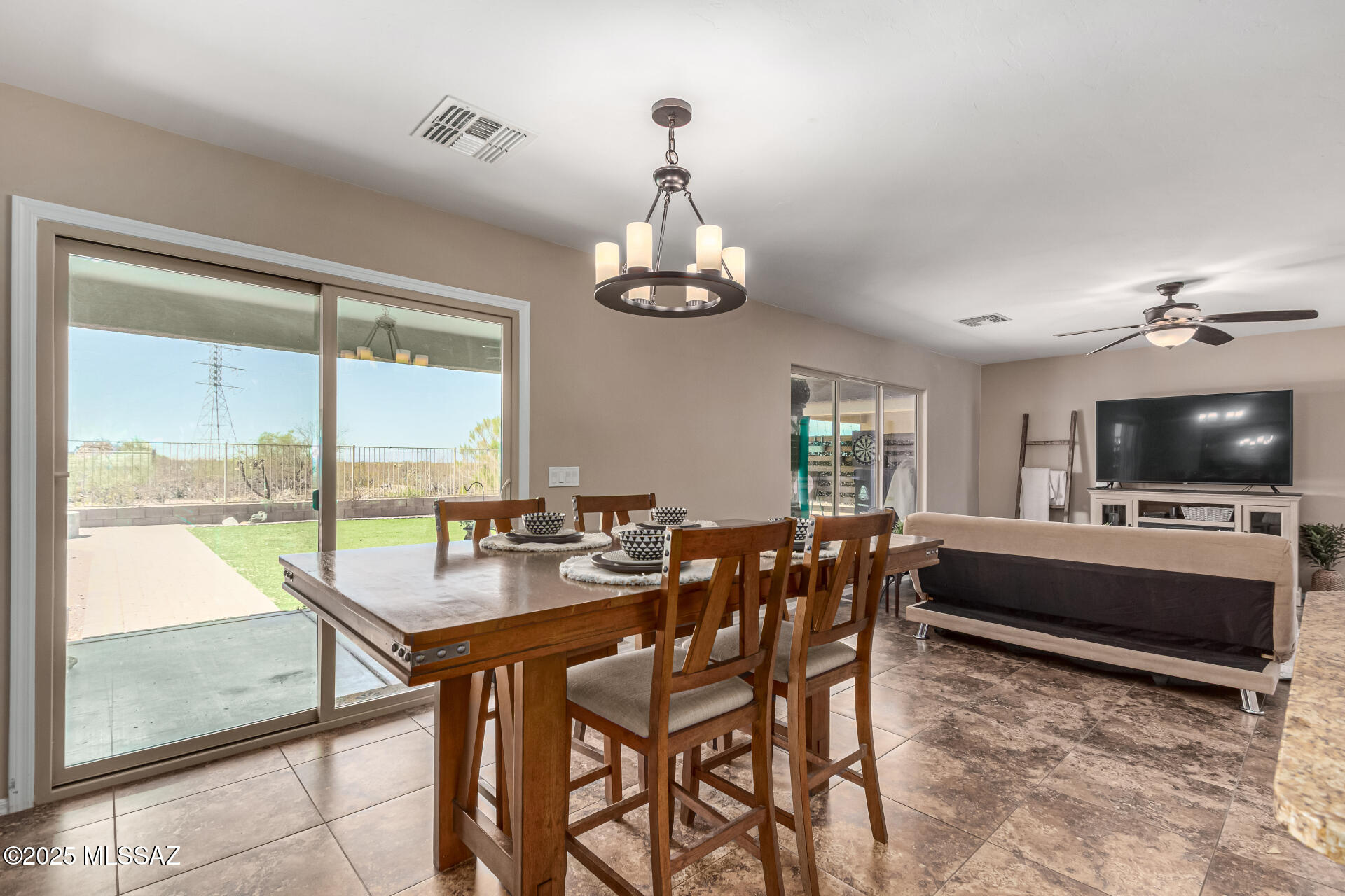 9528 Desert Fauna Loop Tucson, AZ 85747 - Photo 11 of 46 a view of a dining room with furniture window and outside view