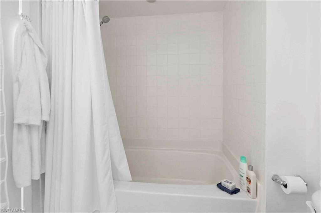 601 Northeast 36th Street, Unit 712 Miami, FL 33137 - Photo 12 of 28 a close up of a bathtub curtain