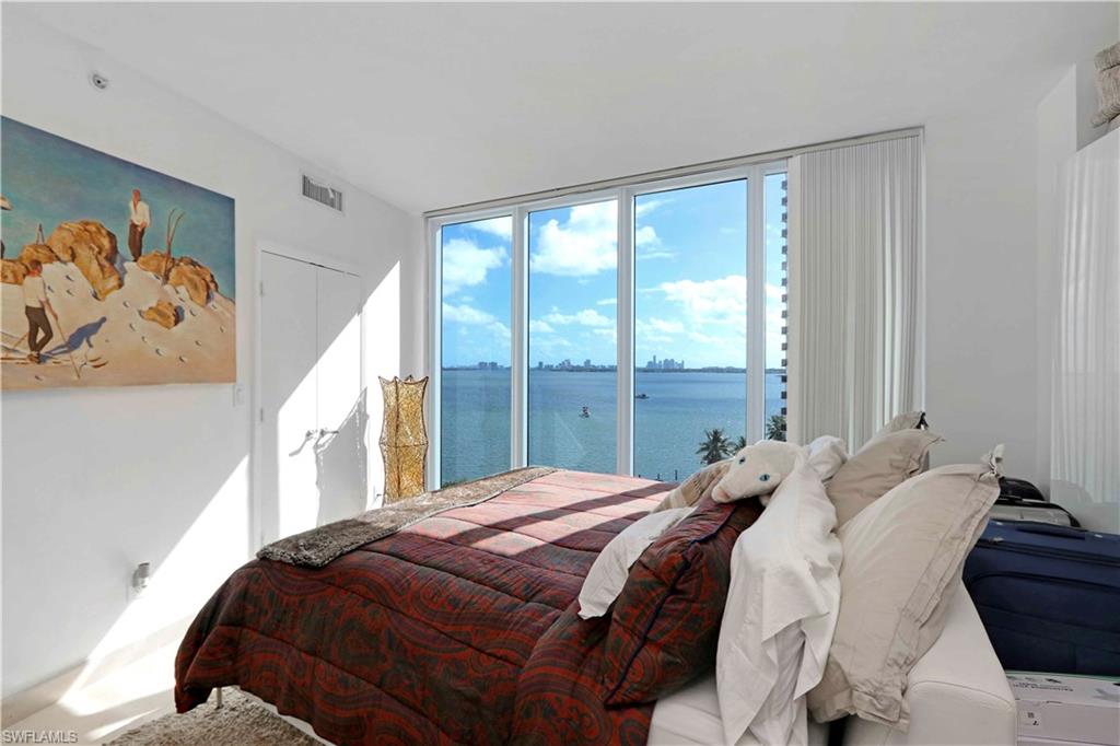 601 Northeast 36th Street, Unit 712 Miami, FL 33137 - Photo 14 of 28 a bedroom with a large bed and a window