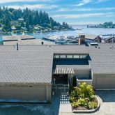 a view of a terrace with a bench and a potted plants
