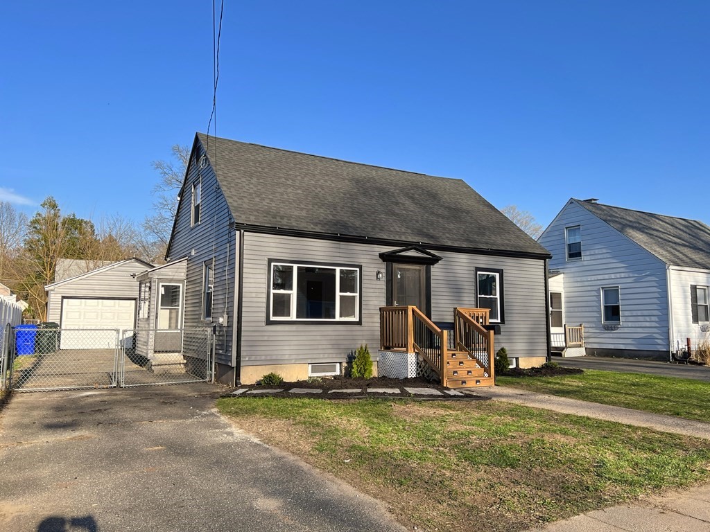 145 Powell Avenue Springfield, MA 01118 - Photo 1 of 10 a house view with a garden space