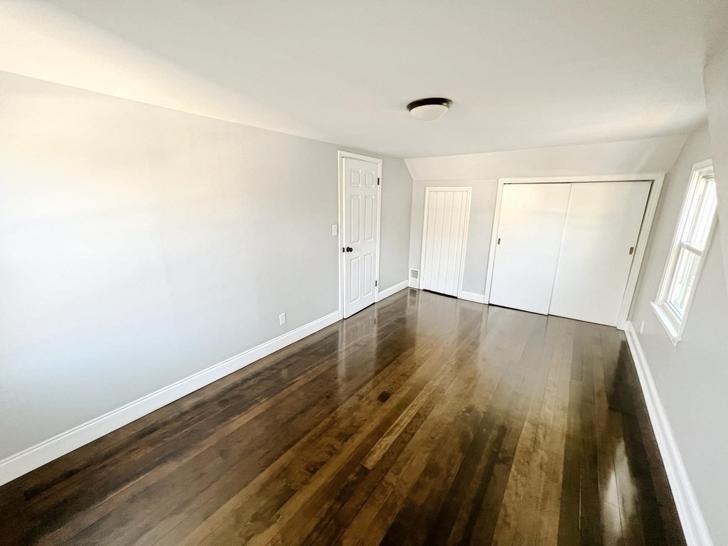 145 Powell Avenue Springfield, MA 01118 - Photo 9 of 10 a view of wooden floor in an empty room