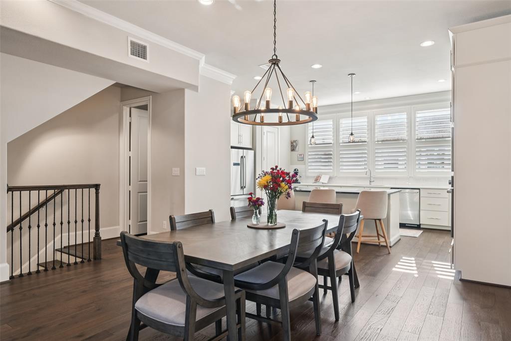 2815 Lynlock Court Dallas, TX 75219 - Photo 1 of 39 a view of a dining room with furniture and wooden floor