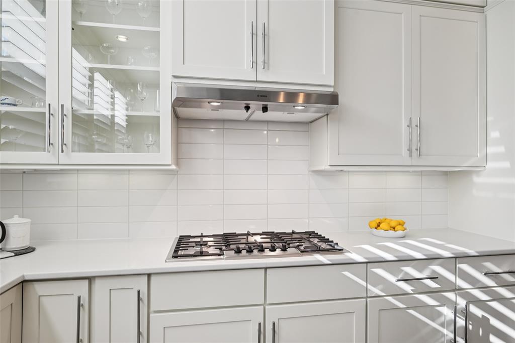 2815 Lynlock Court Dallas, TX 75219 - Photo 11 of 39 a stove top oven sitting inside of a kitchen
