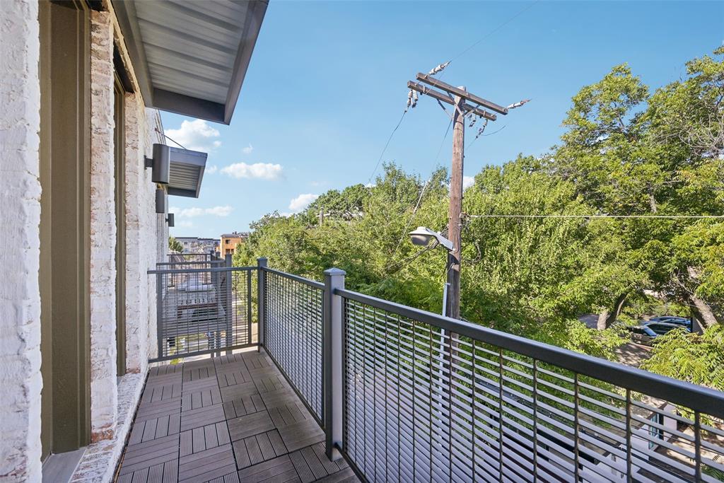 2815 Lynlock Court Dallas, TX 75219 - Photo 18 of 39 a view of a balcony with wooden floor
