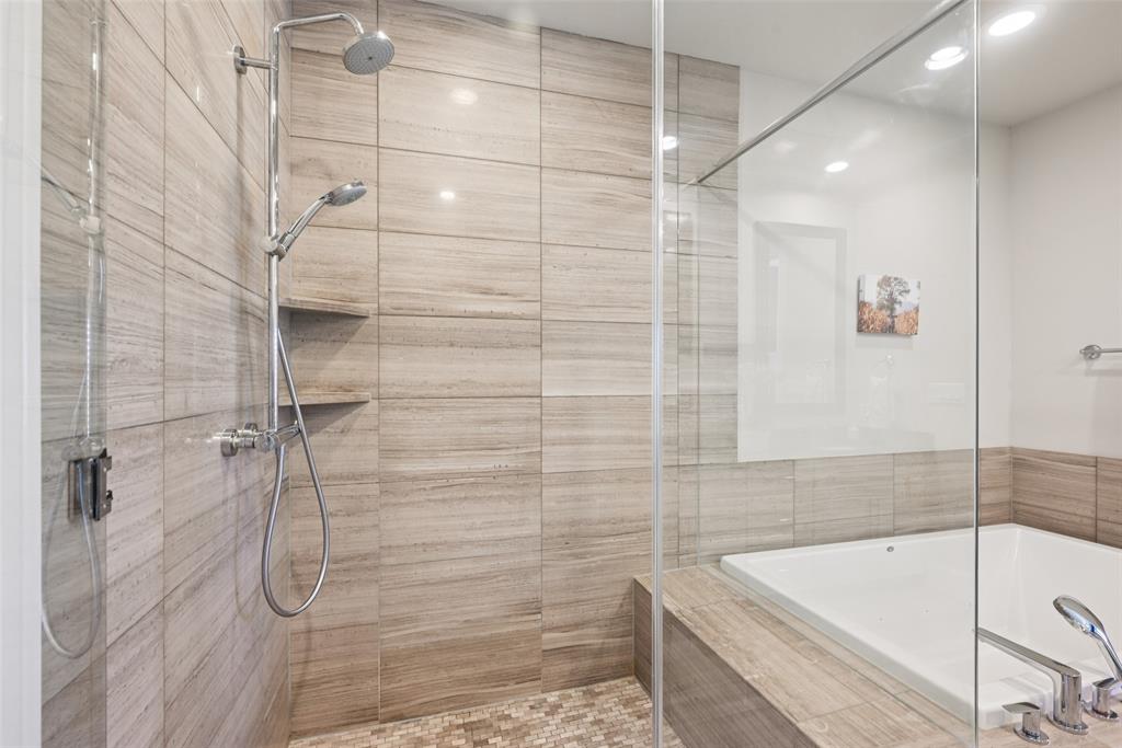 2815 Lynlock Court Dallas, TX 75219 - Photo 22 of 39 a bathroom with a bathtub and shower