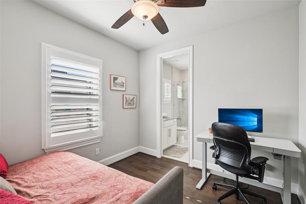 2815 Lynlock Court Dallas, TX 75219 - Photo 24 of 39 a bedroom with a workspace