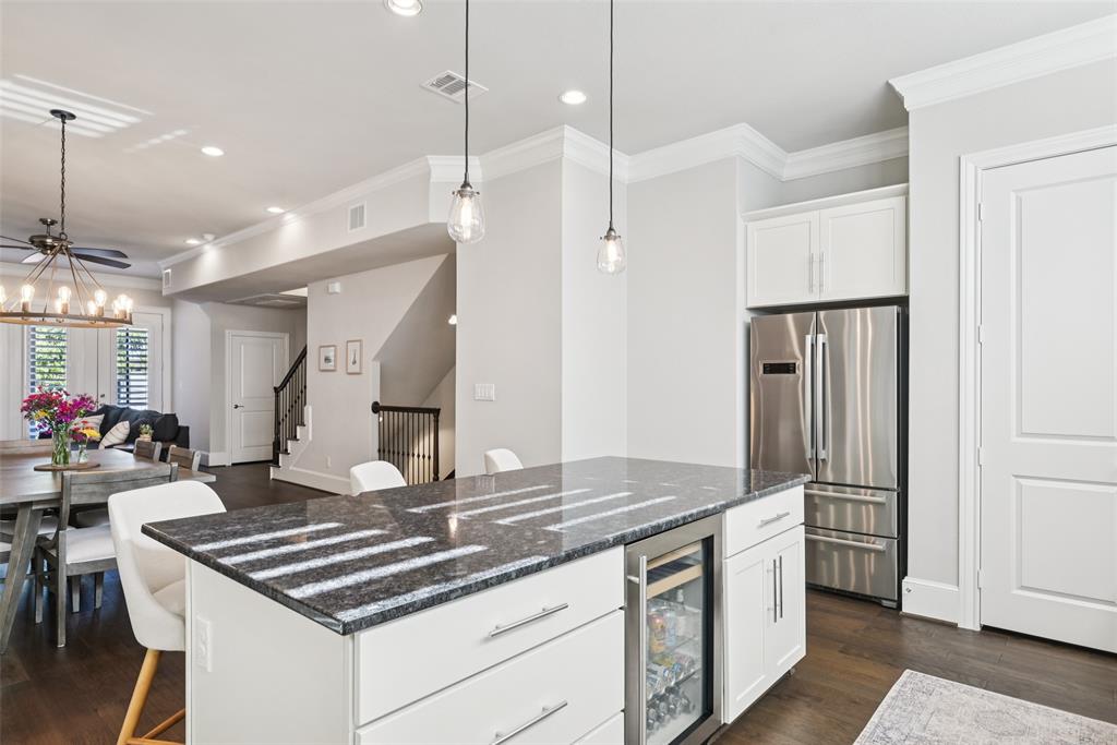 2815 Lynlock Court Dallas, TX 75219 - Photo 10 of 39 a open kitchen with stainless steel appliances granite countertop a stove a refrigerator and a refrigerator