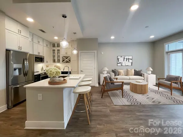 a bathroom with a double vanity sink toilet mirror and bathtub