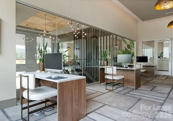 a view of a workspace with furniture