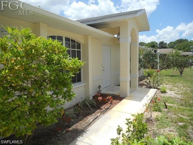 8402 Butternut Road Fort Myers, FL 33967 - Photo 2 of 13 a front view of house with yard