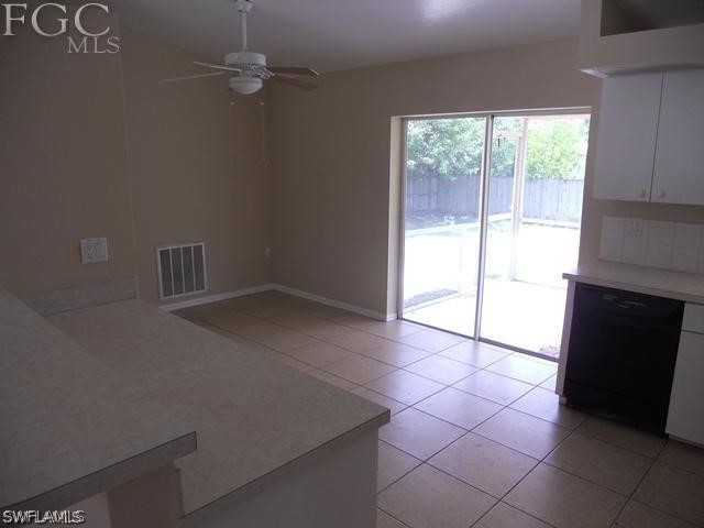 8402 Butternut Road Fort Myers, FL 33967 - Photo 5 of 13 an empty room with windows