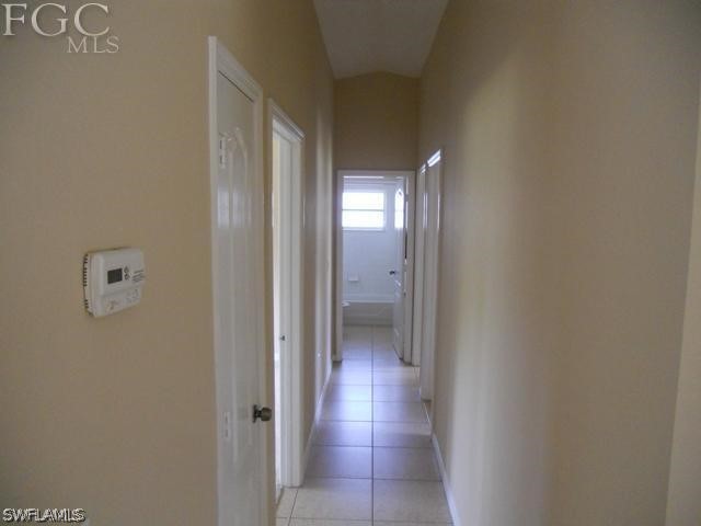 8402 Butternut Road Fort Myers, FL 33967 - Photo 7 of 13 a view of a hallway with wooden floor