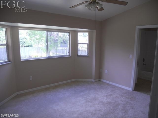 8402 Butternut Road Fort Myers, FL 33967 - Photo 8 of 13 an empty room with a window