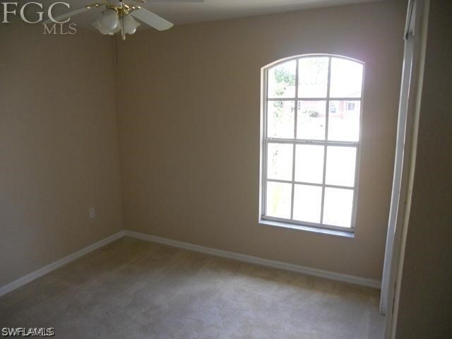 8402 Butternut Road Fort Myers, FL 33967 - Photo 10 of 13 an empty room with a window