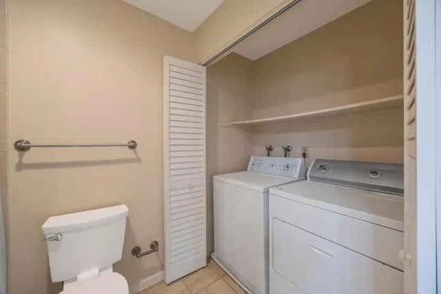 a bathroom with a toilet sink and vanity