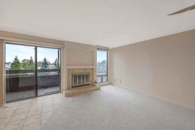 an empty room with a fireplace