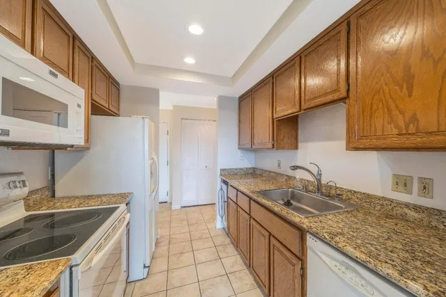 a kitchen that has a sink and a stove