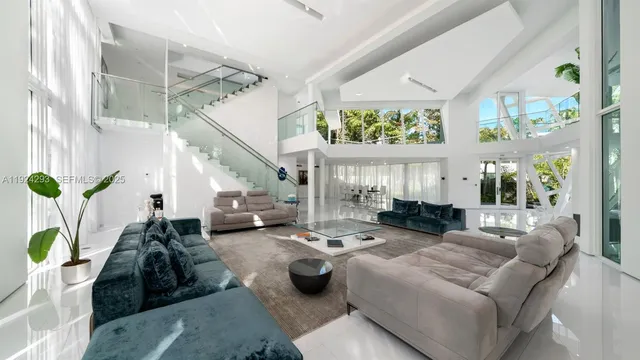 a living room with furniture potted plant and a chandelier