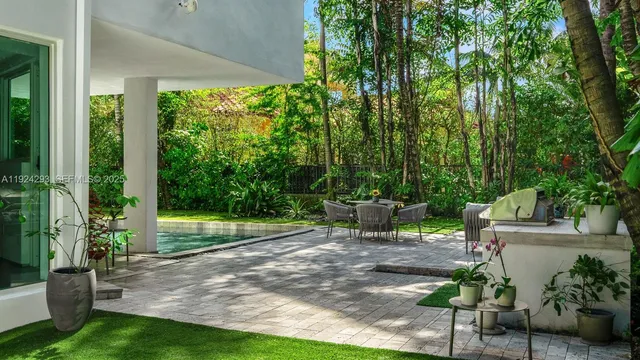 a view of a chair and tables in the garden
