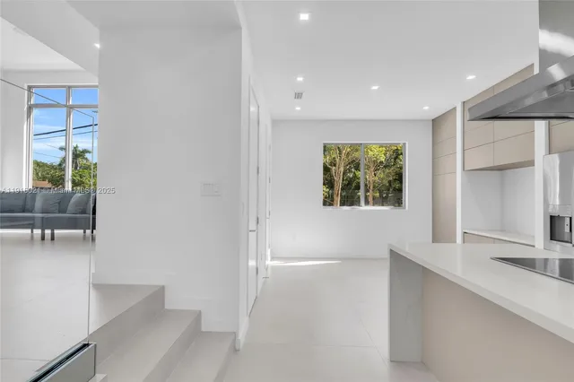 a kitchen with a sink and a window